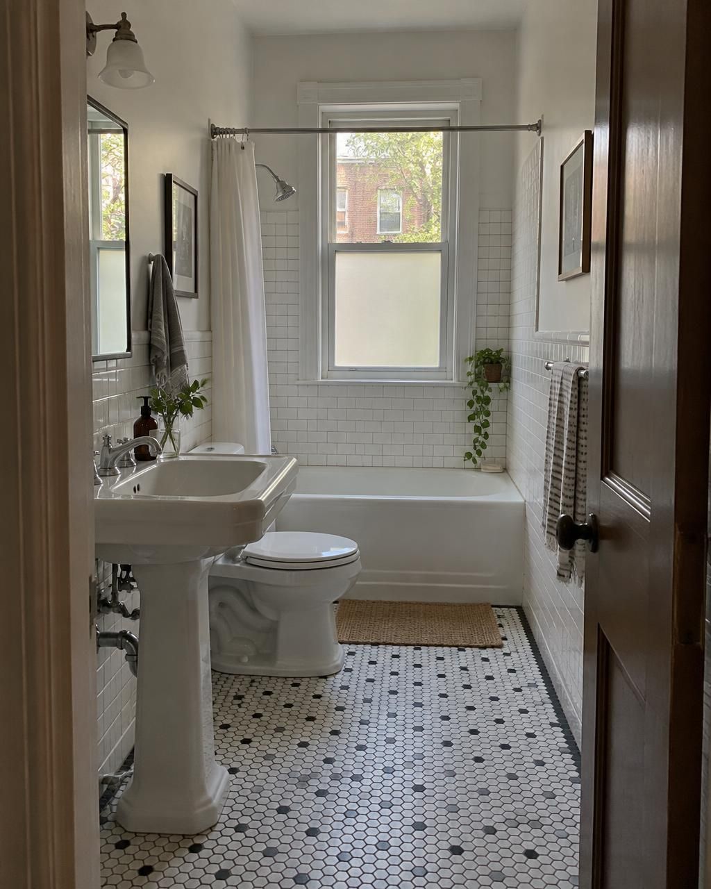 Illustration of a narrow rowhouse bathroom with white tile.