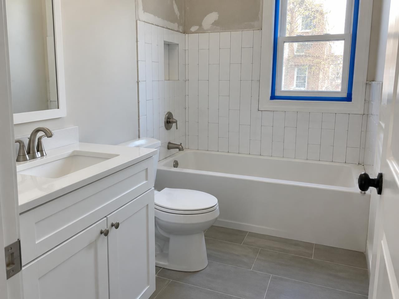 Illustration of a bathroom partway through a remodel.